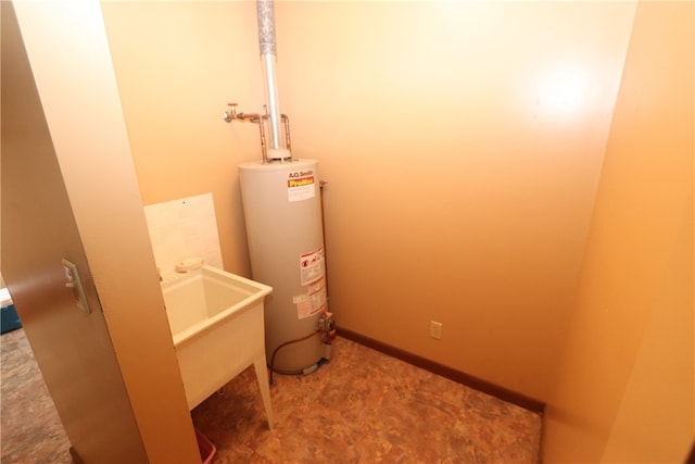 utility room featuring gas water heater