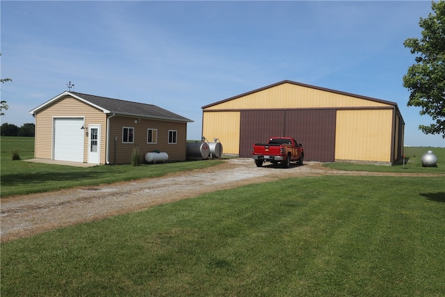 view of outbuilding featuring a lawn