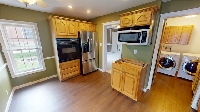 112 N 3rd St, Hoopeston, IL 60942 - kitchen featuring stainless steel appliances, washing machine and clothes dryer, dark wood-type flooring, baseboards, and recessed lighting