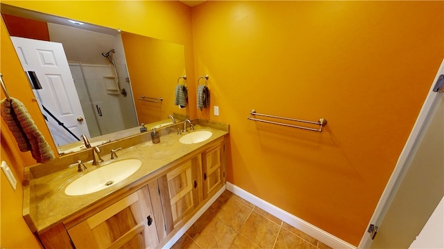 112 N 3rd St, Hoopeston, IL 60942 - bathroom featuring baseboards, double vanity, an enclosed shower, and tile patterned flooring