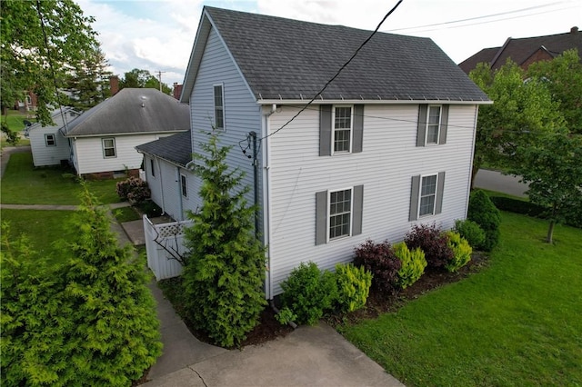 112 N 3rd St, Hoopeston, IL 60942 - view of property exterior with roof with shingles