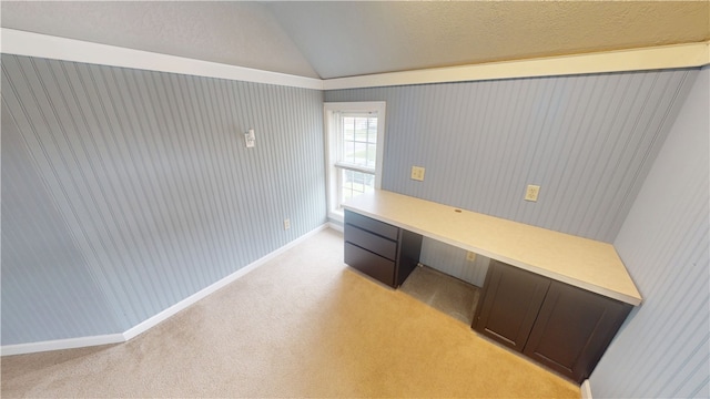 112 N 3rd St, Hoopeston, IL 60942 - unfurnished office with built in study area, light carpet, vaulted ceiling, and baseboards