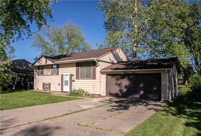 1515 Eastview Ave, Danville, IL 61832 - view of front of house featuring a front yard, an attached garage, and concrete driveway