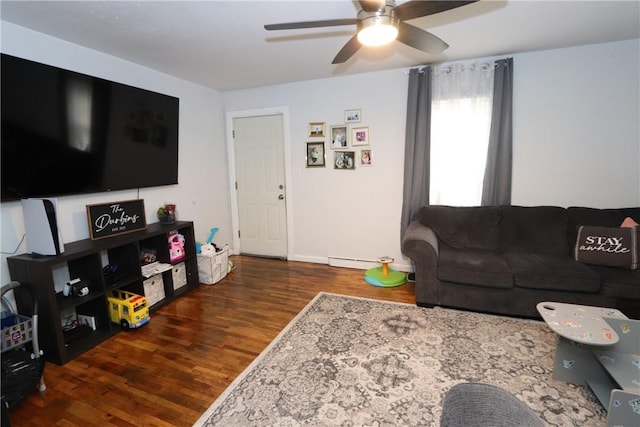 living room featuring ceiling fan, dark hardwood / wood-style flooring, and a baseboard heating unit