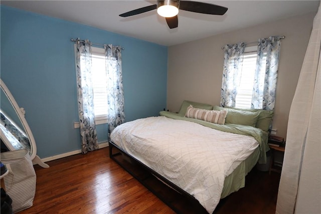 bedroom featuring ceiling fan and dark hardwood / wood-style floors