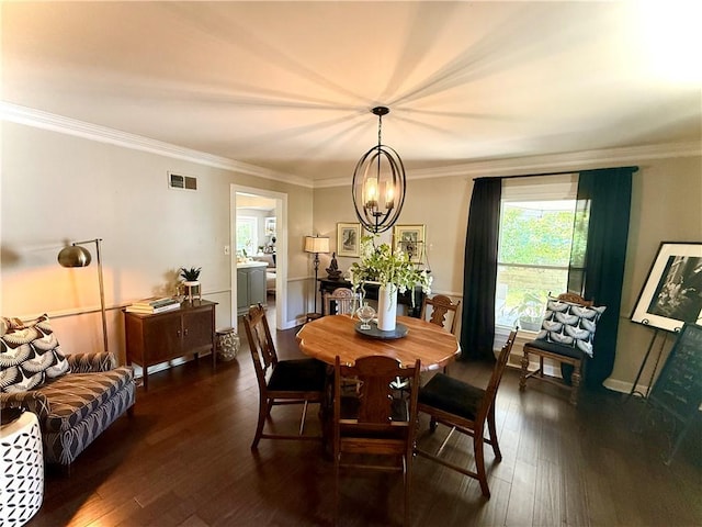 141 Hightide Dr, Decatur, IL 62521 - dining area with a chandelier, dark wood-style floors, and ornamental molding