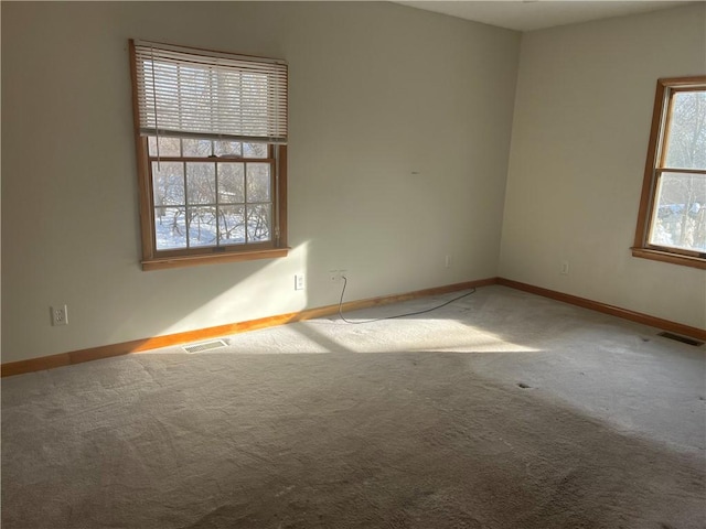 unfurnished room with carpet flooring