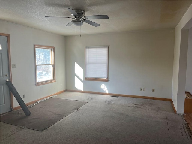 empty room with light carpet and ceiling fan