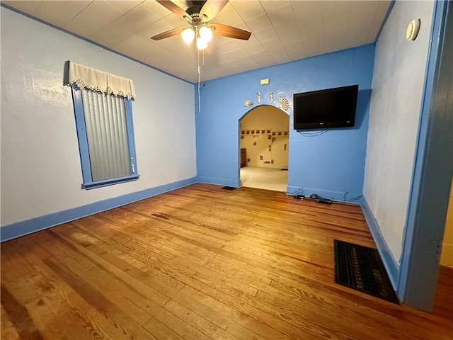 spare room featuring ceiling fan and light hardwood / wood-style floors