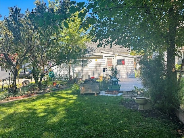 exterior space with a lawn, a patio area, and central air condition unit