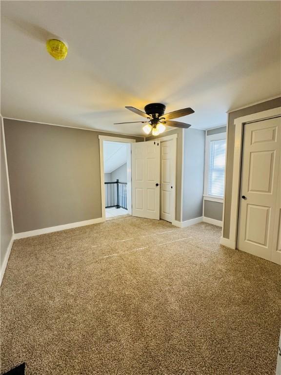 interior space featuring ceiling fan