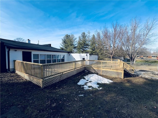 back of house with a wooden deck