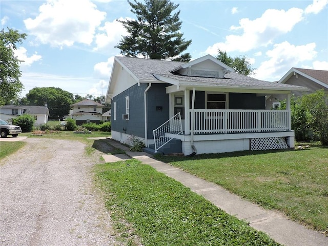 1511 Oak St, Danville, IL 61832 - bungalow-style house with a porch, roof with shingles, a front lawn, and driveway