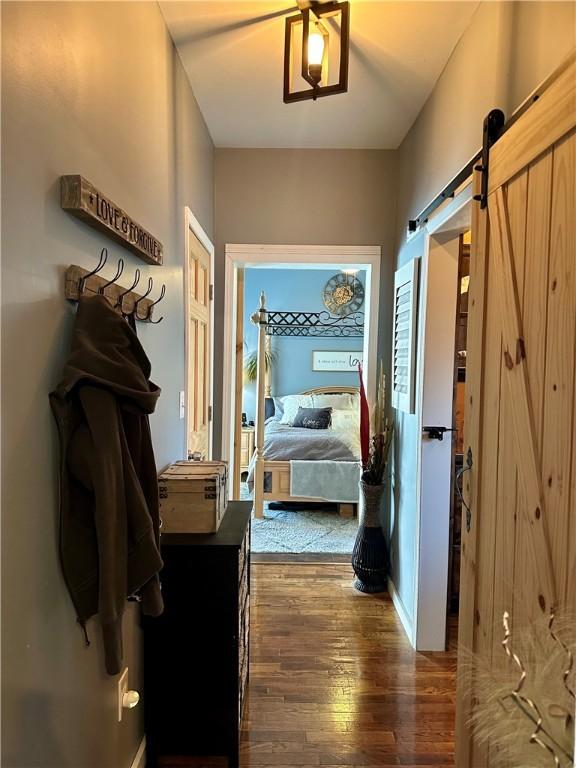 808 Moultrie Ave, Mattoon, IL 61938 - hallway with hardwood / wood-style floors and a barn door