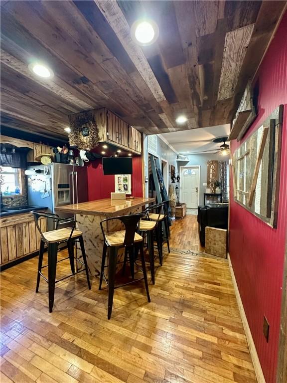 808 Moultrie Ave, Mattoon, IL 61938 - bar with wood ceiling, light wood-style floors, high end refrigerator, and a ceiling fan