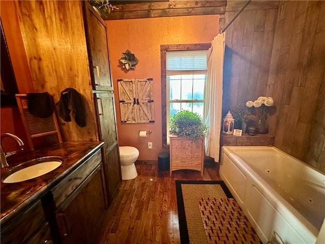 808 Moultrie Ave, Mattoon, IL 61938 - full bathroom featuring wood finished floors, vanity, and wood walls