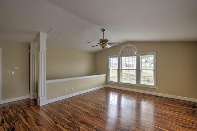 spare room featuring baseboards, lofted ceiling, ceiling fan, and wood finished floors