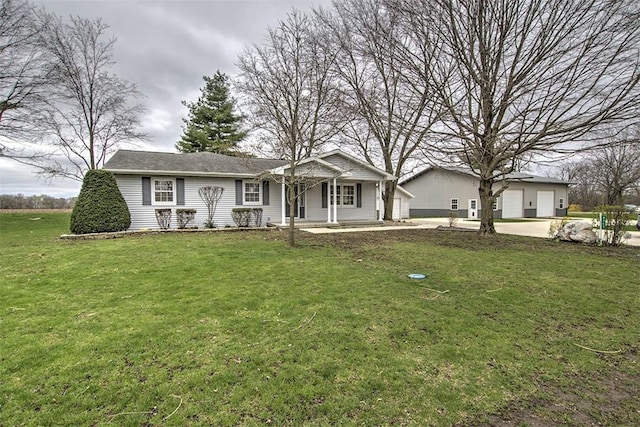 ranch-style house with concrete driveway and a front lawn