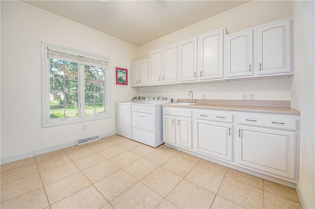 2928 Lakewood Dr, Vandalia, IL 62471 - laundry area with cabinet space, separate washer and dryer, and light tile patterned floors