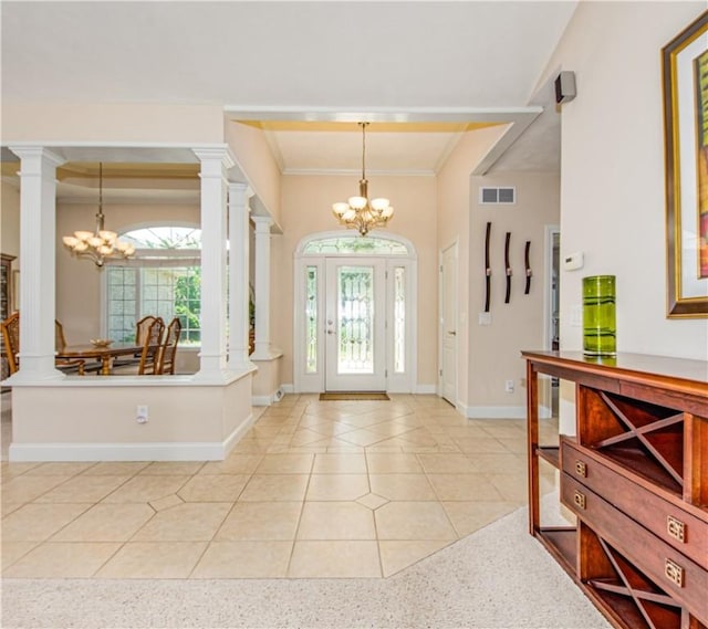 2928 Lakewood Dr, Vandalia, IL 62471 - entrance foyer featuring a chandelier, ornamental molding, ornate columns, and light tile patterned floors