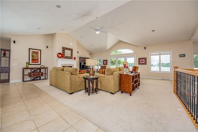 2928 Lakewood Dr, Vandalia, IL 62471 - living room with a ceiling fan, vaulted ceiling, light tile patterned floors, a fireplace, and light carpet