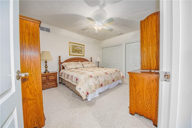 2928 Lakewood Dr, Vandalia, IL 62471 - bedroom featuring multiple closets, light colored carpet, and ceiling fan