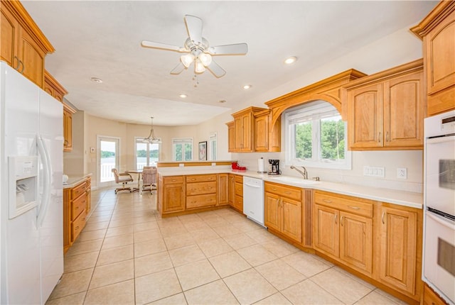 2928 Lakewood Dr, Vandalia, IL 62471 - kitchen with white appliances, a peninsula, plenty of natural light, light countertops, and recessed lighting