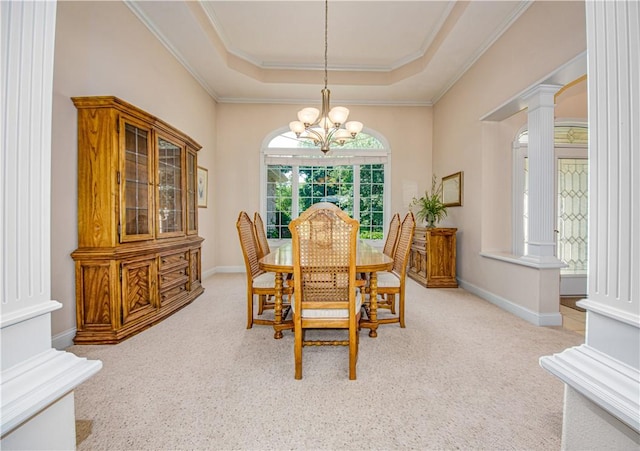 2928 Lakewood Dr, Vandalia, IL 62471 - dining area with a tray ceiling, decorative columns, a chandelier, carpet flooring, and ornamental molding