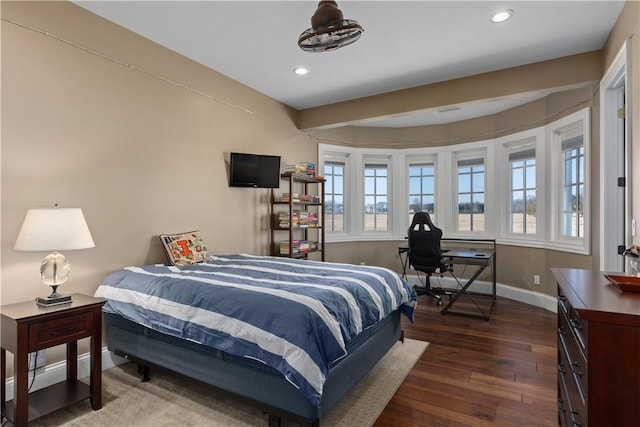 bedroom featuring multiple windows, baseboards, dark wood-type flooring, and recessed lighting