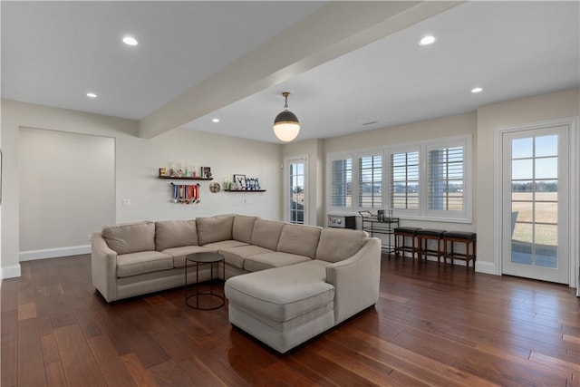 living area featuring dark wood-type flooring, beamed ceiling, recessed lighting, and baseboards