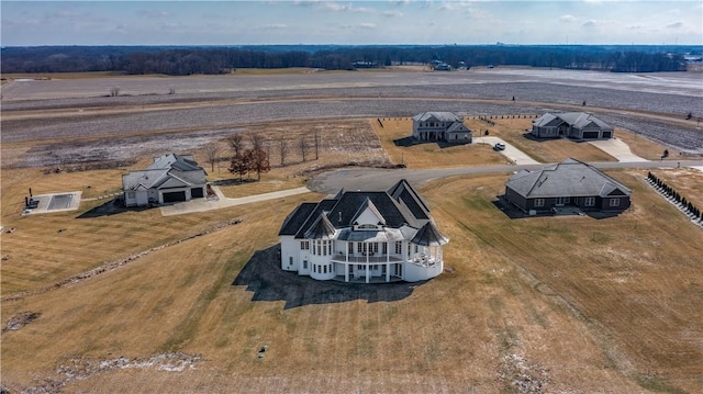 birds eye view of property featuring a rural view