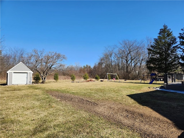 view of yard featuring an outbuilding and a playground