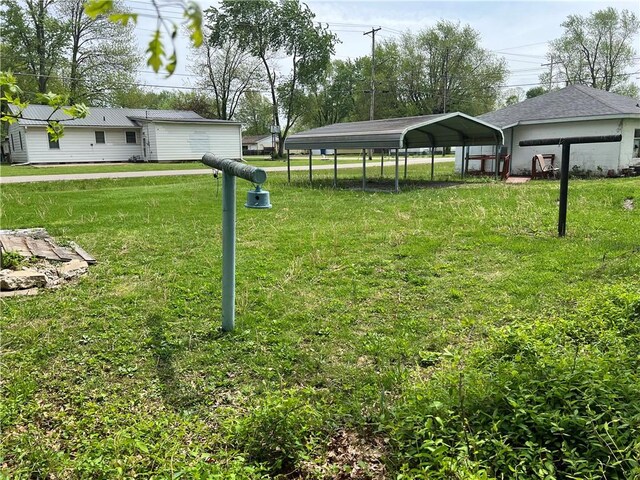 702 W Mulberry St, Robinson, IL 62454 - view of yard with a detached carport