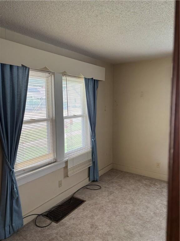 106 W Wernsing Ave, Effingham, IL 62401 - unfurnished room featuring a textured ceiling and light colored carpet
