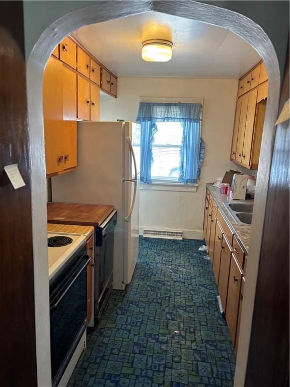 106 W Wernsing Ave, Effingham, IL 62401 - kitchen with electric stove, dishwashing machine, arched walkways, a sink, and light countertops