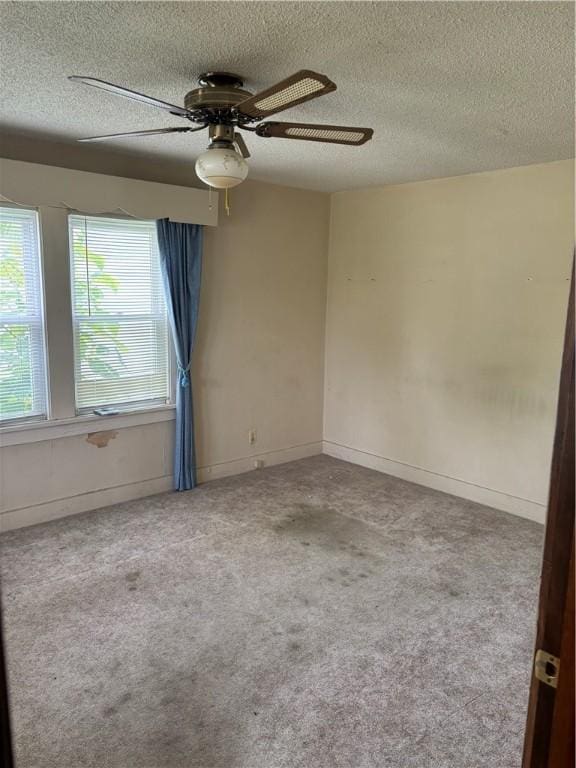 106 W Wernsing Ave, Effingham, IL 62401 - carpeted empty room with a textured ceiling and ceiling fan