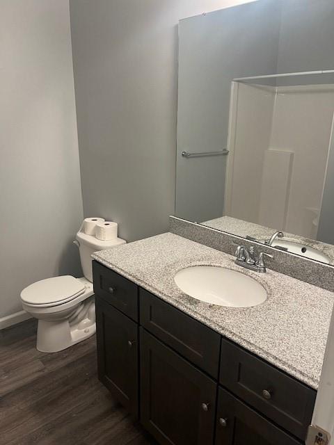 609 W Clinton Ave, Effingham, IL 62401 - bathroom featuring wood finished floors and vanity