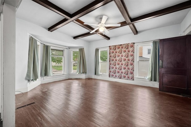 spare room featuring beam ceiling, wood finished floors, visible vents, coffered ceiling, and baseboards