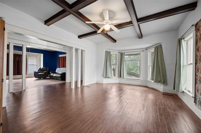 living area with ceiling fan, coffered ceiling, wood finished floors, and beamed ceiling