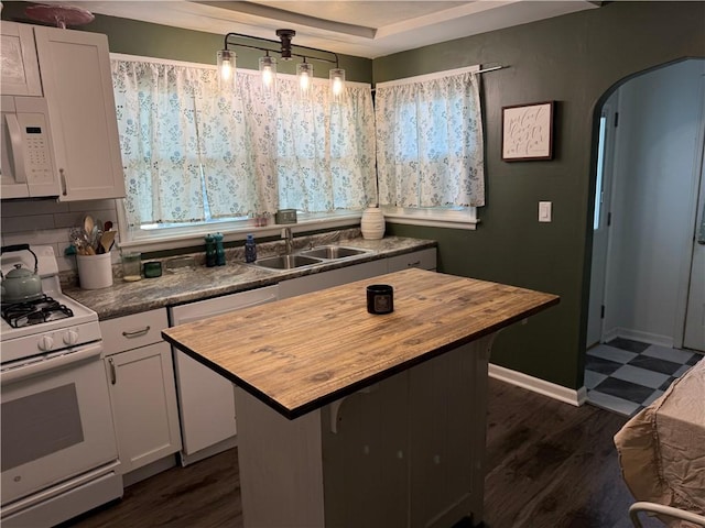 509 E Gordon Ave, Effingham, IL 62401 - kitchen with white appliances, butcher block countertops, arched walkways, and dark wood-style flooring