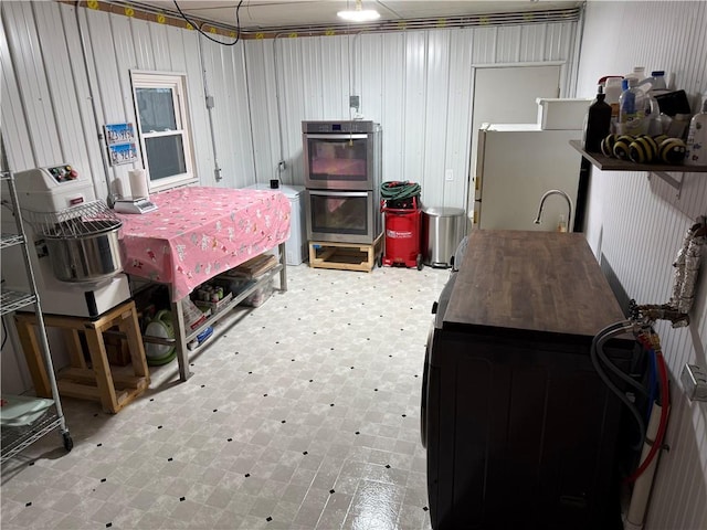 509 E Gordon Ave, Effingham, IL 62401 - below grade area with tile patterned floors and white refrigerator