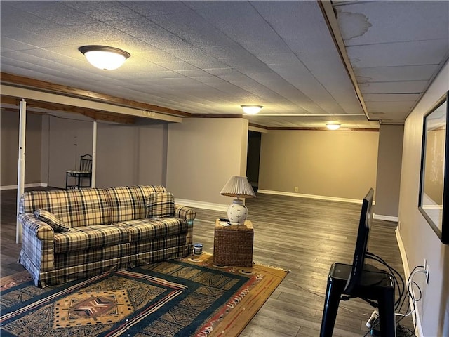 living area with wood finished floors and baseboards