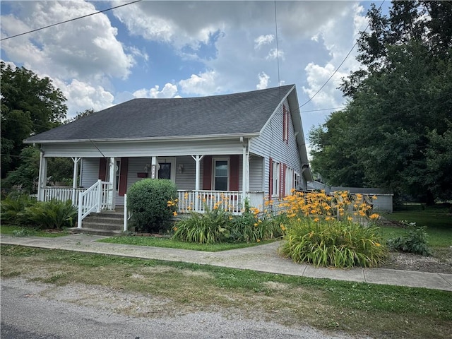 1524 Adams Ave, Charleston, IL 61920 - bungalow-style home with covered porch and a shingled roof