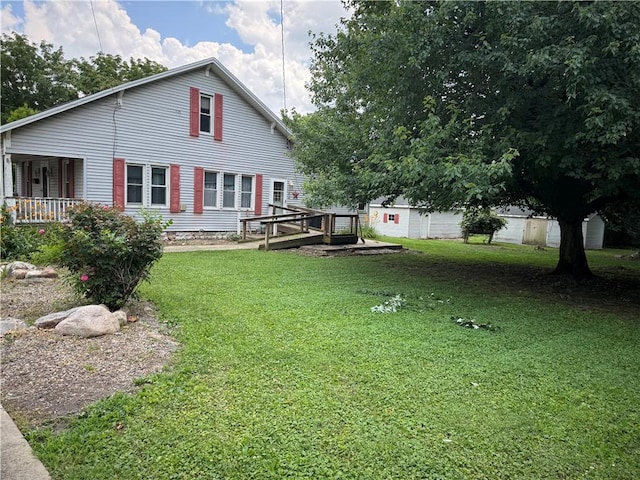 1524 Adams Ave, Charleston, IL 61920 - back of house with a lawn and a porch