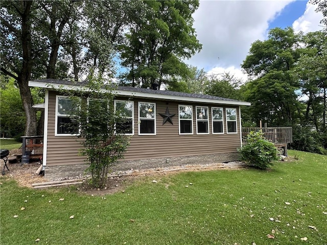 221 Celebration Ct, Oakwood, IL 61858 - view of property exterior featuring a yard and a wooden deck
