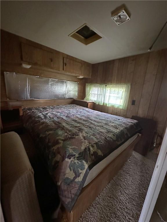 221 Celebration Ct, Oakwood, IL 61858 - bedroom featuring wood walls