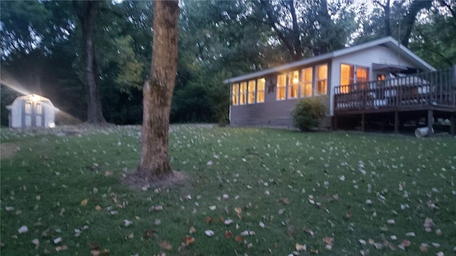 221 Celebration Ct, Oakwood, IL 61858 - view of front facade with a front yard, a deck, crawl space, and a storage unit