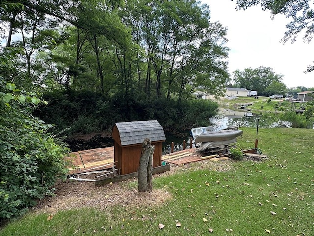 221 Celebration Ct, Oakwood, IL 61858 - view of grassy yard featuring a storage unit