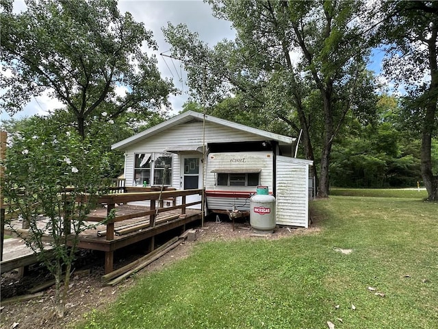 221 Celebration Ct, Oakwood, IL 61858 - rear view of house featuring a yard and a wooden deck