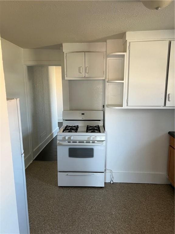 kitchen featuring white cabinetry and white appliances